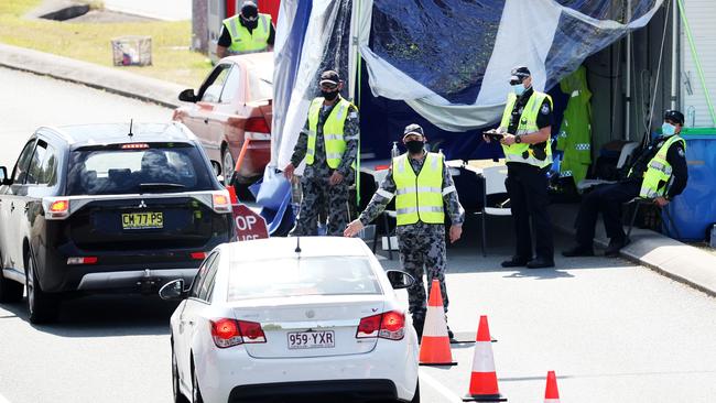 Police and the Defence Force patrol the Queensland border at Coolangatta on Tuesday. Picture: Nigel Hallett