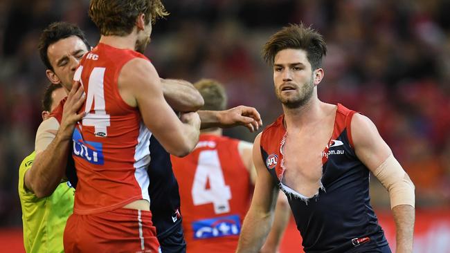 Dane Rampe of the Swans remonstrates with Tomas Bugg.