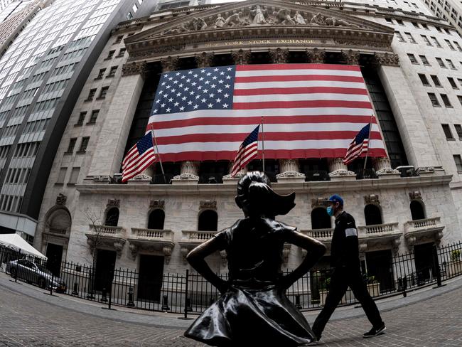 The fearless girl statue and the New York Stock Exchange (NYSE). Picture: AFP