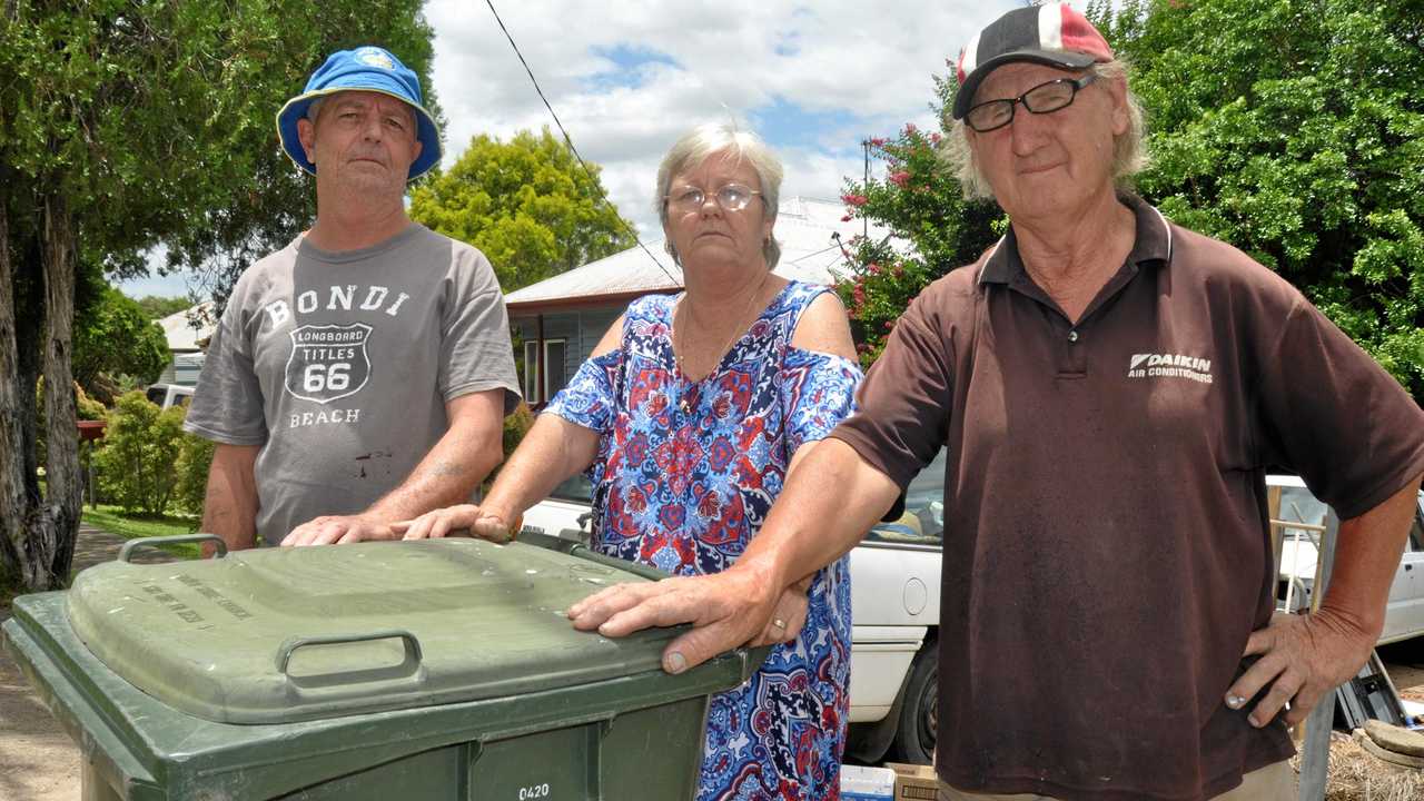 RUBBISH: Dalton St residents Debbie O'Sullivan, Brian White and Malcom Miller are fed up with flooding caused by the poor drainage on their busted gutter. Picture: Mackenzie Colahan