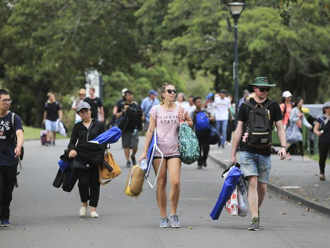 Crowds flock into Mrs Macquarie's Chair to claim positions for tonight's New Years Eve celebrations in Sydney. Picture: Dylan Robinson