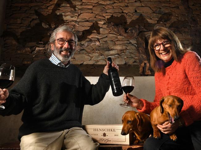 Stephen and Prue Henschke with the 2015 Hill of Grace pictured at their cellar door with dogs Lotti and Fritzwilly. Picture: Tricia Watkinson