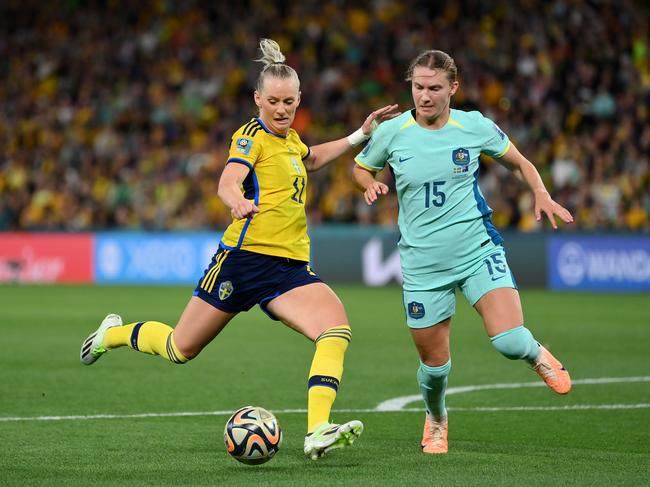 BRISBANE, AUSTRALIA - AUGUST 19: Stina Blackstenius of Sweden shoots under pressure from Clare Hunt of Australia during the FIFA Women's World Cup Australia & New Zealand 2023 Third Place Match match between Sweden and Australia at Brisbane Stadium on August 19, 2023 in Brisbane, Australia. (Photo by Justin Setterfield/Getty Images)