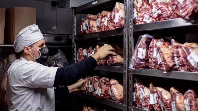 A butcher works at the butcher's shop of the Don Julio restaurant in Palermo neighbourhood, Buenos Aires, Argentina. The Argentinian government has banned beef exports for 30 days in a bid to curb prices. Picture: Ronaldo Schemidt