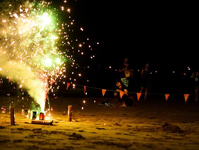 Out front of the Casino felt like a Territory like war zone with fireworks being lit from every direction and the odd one or two ricocheted into crowds, as people waited for the  annual Territory Day fireworks show at Mindil Beach on Sunday night  for the 40th Territory Day celebrations.Picture: Justin Kennedy