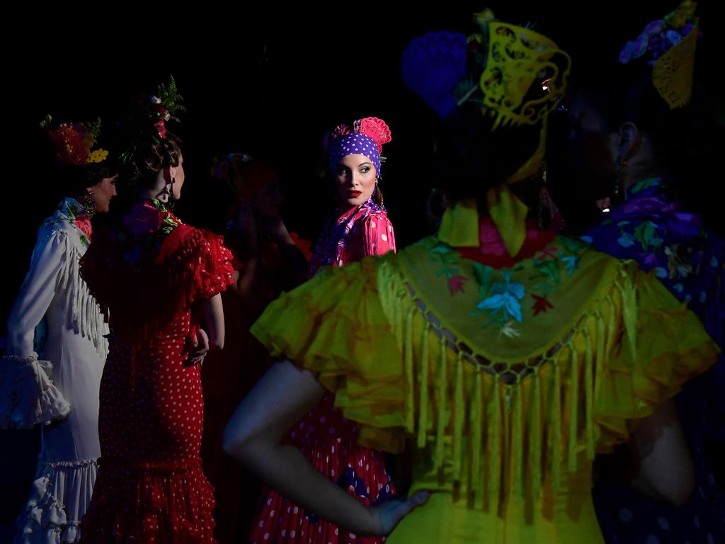 Models wait backstage prior to presenting creations by Pilar Vera during the International Flamenco Fashion Week in Seville. Picture: Cristina Quicler/AFP