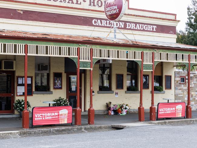 Floral tributes to Hannah McGuire outside the National Hotel in Clunes. Picture: Aaron Francis