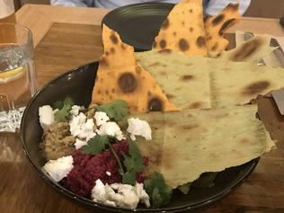 Charred flatbread with dips.