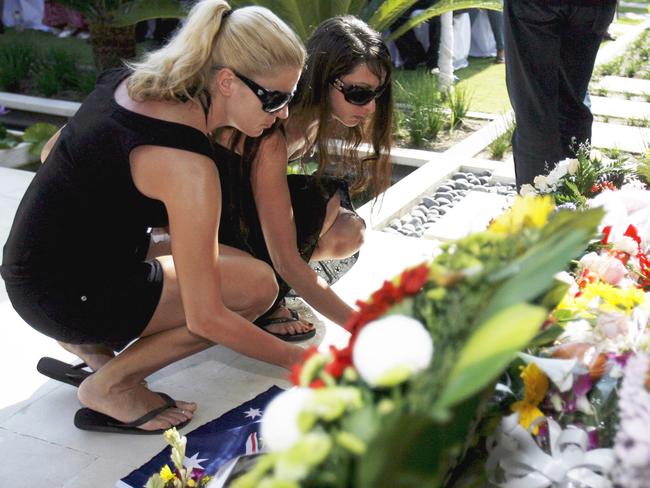 Maria Kotronakis places flowers during a commemoration ceremony at the Australian Consulate in Denpasar in 2007. Picture: AP/Made Nagi
