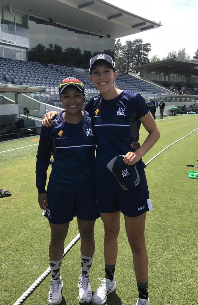 Ace spinner Alana King presents Courtney Neale with her Victorian cap.