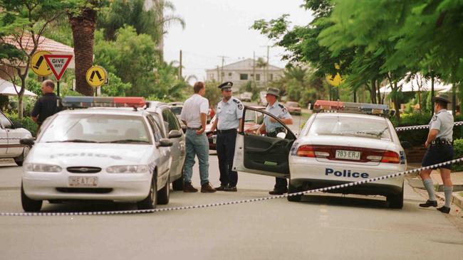 Police in Main Beach on the morning after the murders.