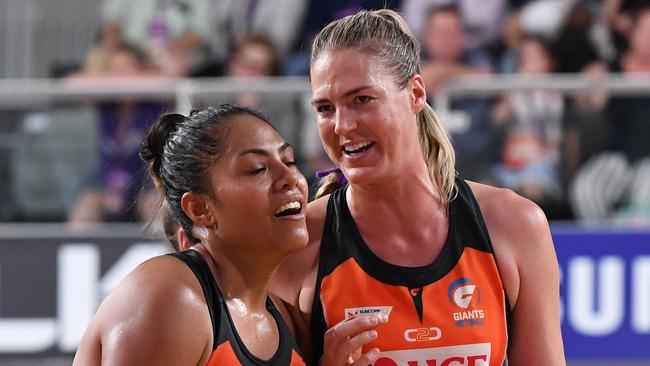 Giants players Kristiana Manu'a (left) and Giants captain Caitlin Bassett.