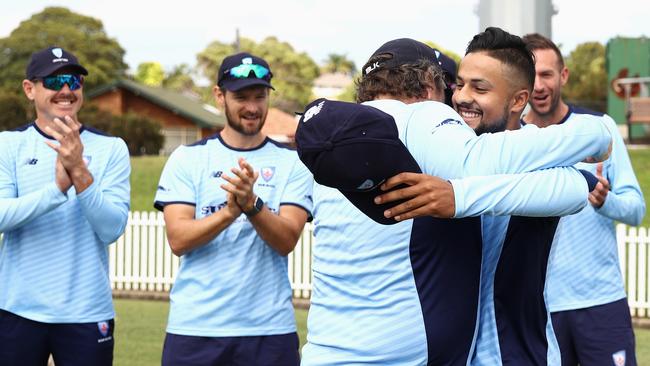 Tanveer Sangha is presented with NSW Cap #756 during day one of the Sheffield Shield last week.