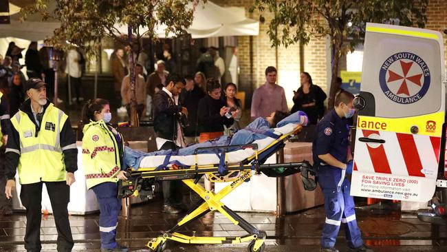 The woman was then taken away in an ambulance. Picture: Damian Shaw