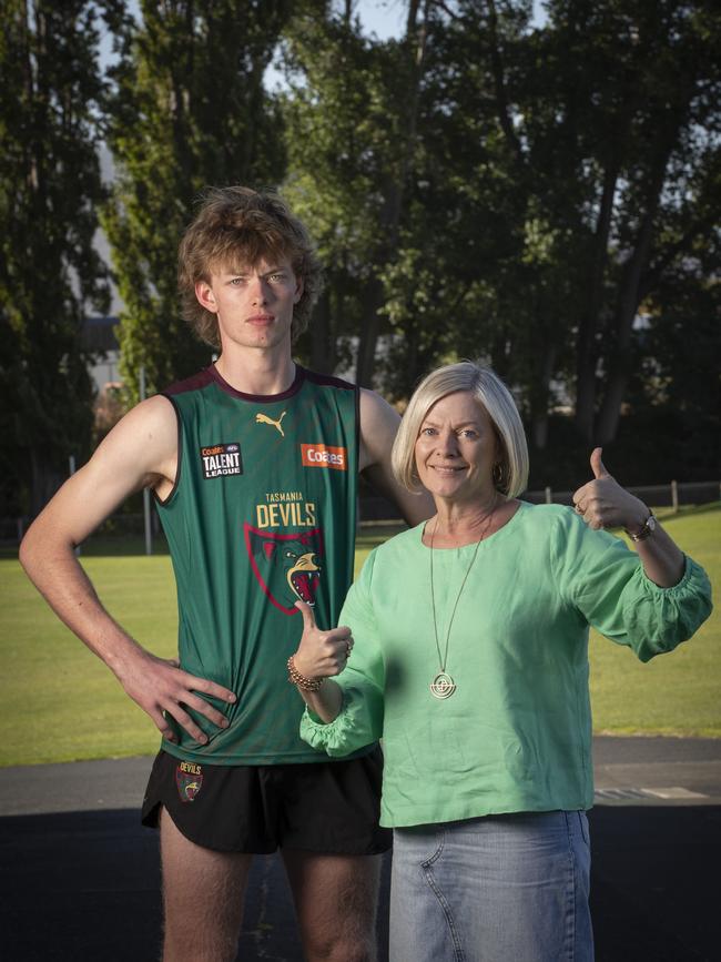 Tassie Devils footballer Jasper Hay and his mum Liz after getting tickets to the launch of the team. Picture: Chris Kidd