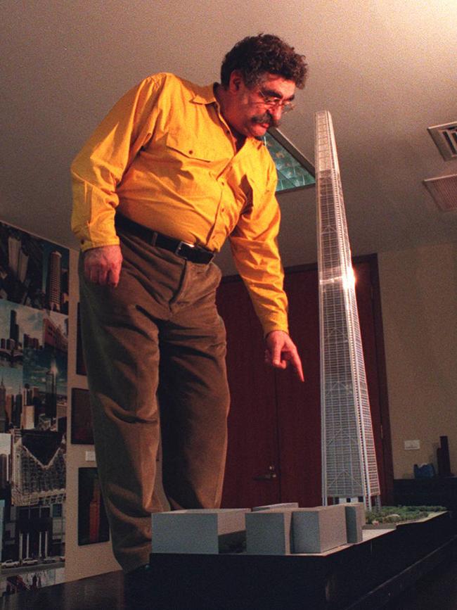 Bruno Grollo standing next to a model of the world's tallest building.