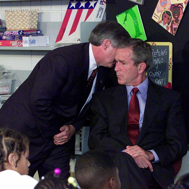 Former chief of staff Andy Card whispers into the ear of then president George W. Bush to give him word of the plane crashes into the World Trade Centre during a visit to the Emma E. Booker Elementary School in Sarasota, Florida. Picture: Doug Mills/AP