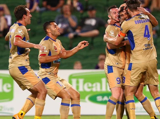 PERTH, AUSTRALIA - DECEMBER 09: John Koutroumbis of the Jets is congratulated by team mates after scoring the equaliser during the round 10 A-League match between the Perth Glory and the Newcastle Jets at nib Stadium on December 9, 2017 in Perth, Australia.  (Photo by Paul Kane/Getty Images)