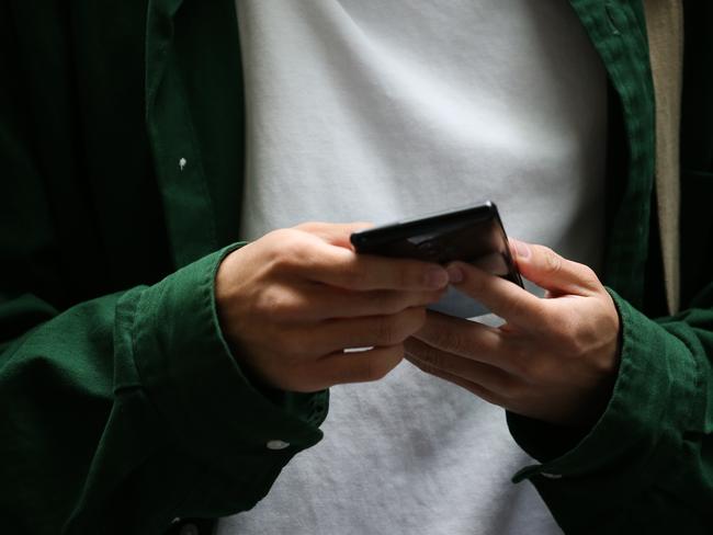 SYDNEY, AUSTRALIA - Newswire Photos DECEMBER 18, 2022: Members of the public are seen using their phone as the personal data of Australians is being stolen at a rate of more than 20 times above the global average new research reveals. Picture: NCA Newswire / Gaye Gerard