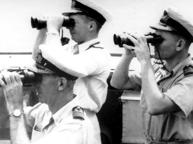 Tasmanians Captain Dechaineux, Commodore Collins, seen here with Commander Rayment on the bridge of HMAS Australia in 1944. (RAN)