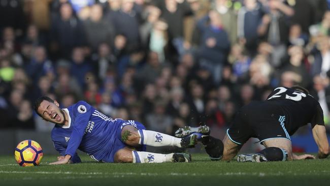 Chelsea's Eden Hazard (L) goes down hurt after a foul by West Bromwich Albion's Gareth McAuley.