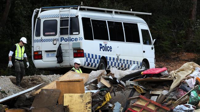 Police look for evidence, relating to the disappearance of a local man, at the Ulverstone tip. Pictures: CHRIS KIDD