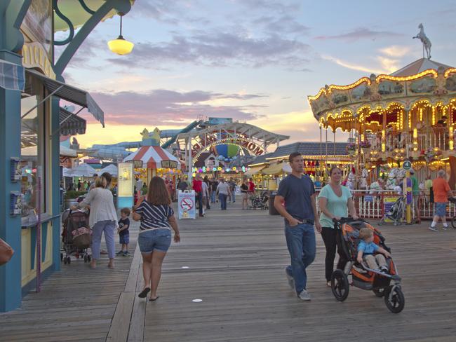 Wildwood, New Jersey, USA - September 5, 2014: Tourists on Morey's Pier walk the two mile long boardwalk that is full of rides, shopping and other entertainments on September 5, 2014 in Wildwood, New Jersey