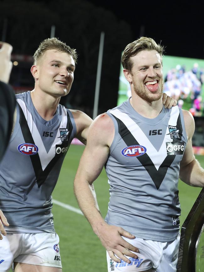 Ollie Wines and Tom Jonas celebrate Port’s Showdown win earlier this year. Picture: Sarah Reed