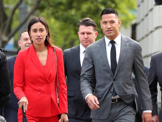 Israel Folau arrives at the Federal Court in Melbourne for mediation with Rugby Australia, along with his wife Maria. Picture: David Geraghty