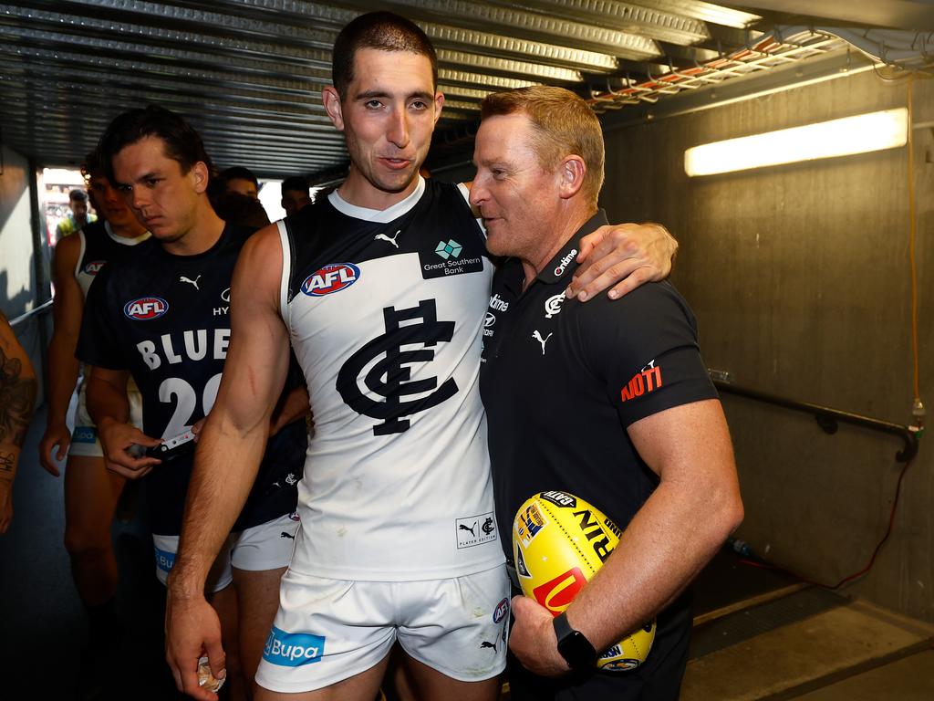 ADELAIDE, AUSTRALIA - APRIL 06: Jacob Weitering of the Blues and Michael Voss, Senior Coach of the Blues celebrate during the 2024 AFL Round 04 match between the Fremantle Dockers and the Carlton Blues at Adelaide Oval on April 06, 2024 in Adelaide, Australia. (Photo by Michael Willson/AFL Photos via Getty Images)