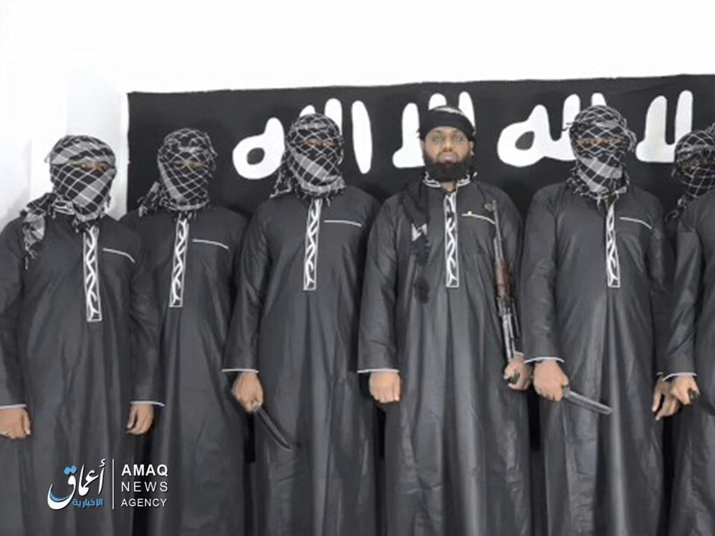 This image posted by the Islamic State group's Aamaq news agency purports to show Mohammed Zahran, a.k.a. Zahran Hashmi, centre, the man Sri Lanka says led the Easter attack, as well as other attackers. Picture: AP