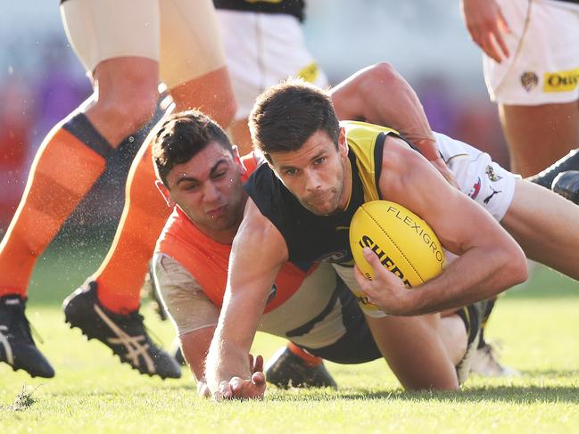 Richmond's Trent Cotchin tackled by Giants Tim Taranto during AFL match between the GWS Giants and Richmond Tigers at Giants Stadium in 2019. Picture. Phil Hillyard