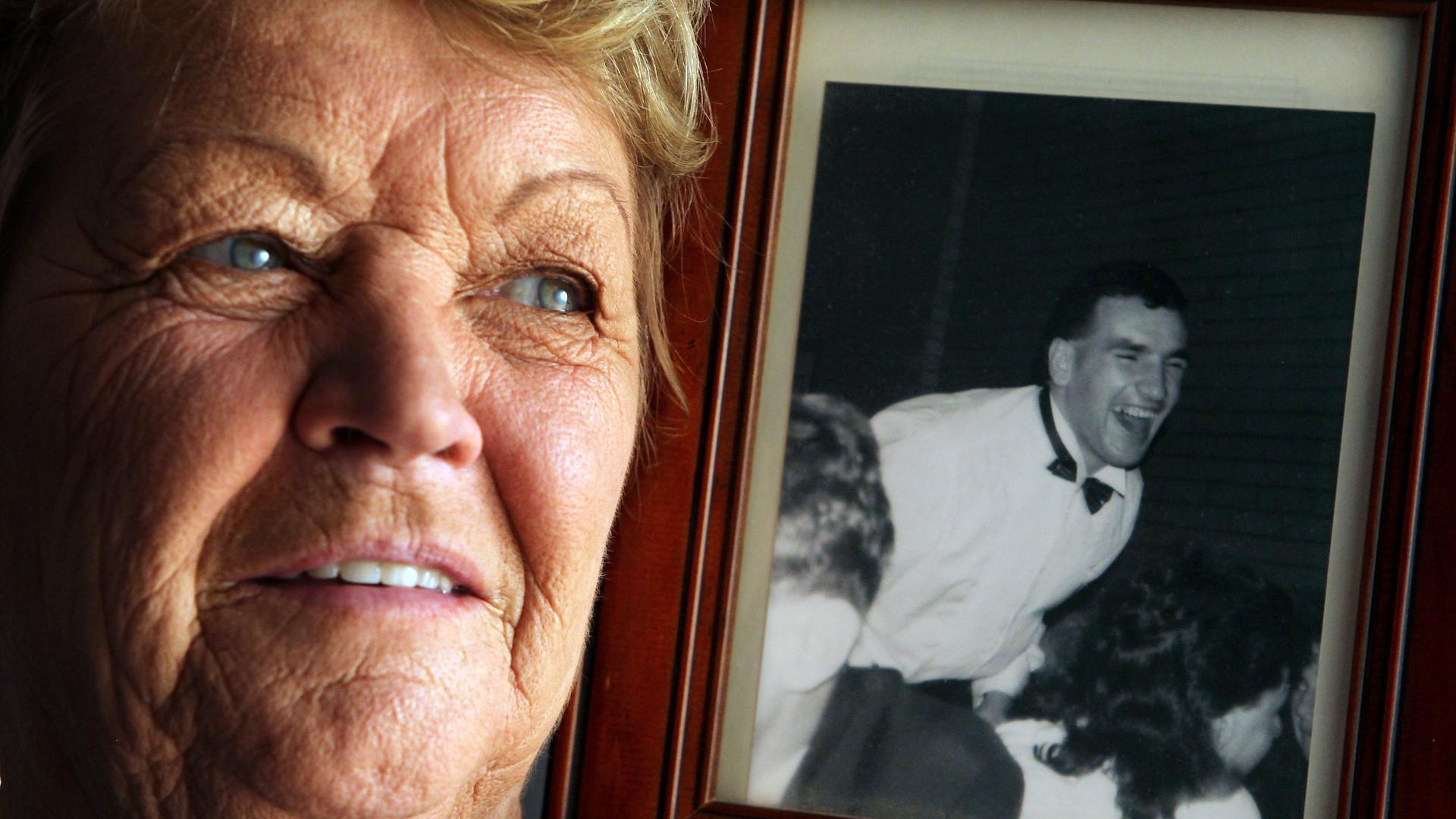 Denise Millane, mother of Collingwood champion Darren Millane who tragically died in a car accident after the 1990 Grand Final. Denise holds her favourite photo of her son.