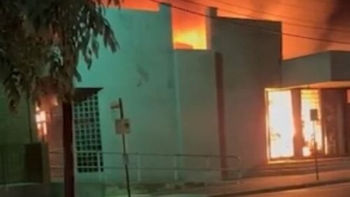 The fire engulfs the Adass Israel Synagogue.