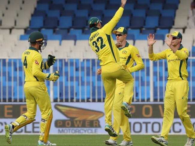 Australian cricketers celebrate the dismissal of Pakistani cricketer Umar Akmal. Picture: Karim Sahib/AFP