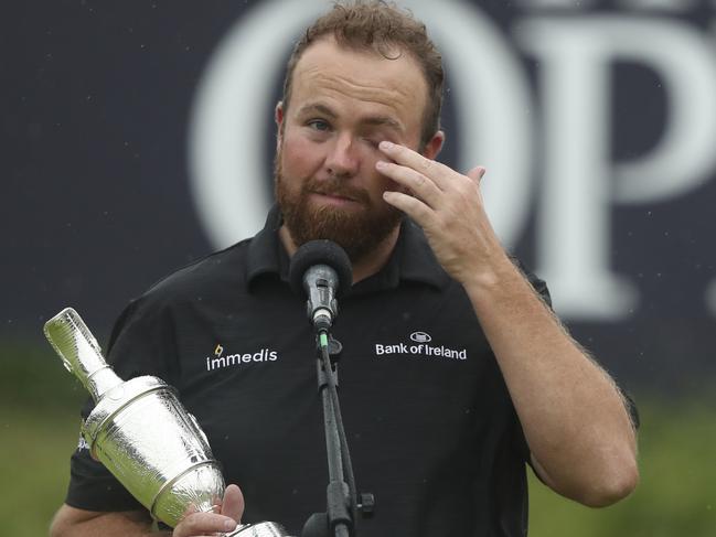 Ireland's Shane Lowry wipes away a tear as he makes a speech holding the Claret Jug trophy after winning the British Open Golf Championships at Royal Portrush in Northern Ireland, Sunday, July 21, 2019.(AP Photo/Jon Super)