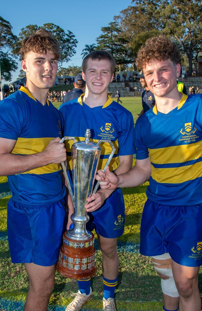 (From left) Trace Beattie, Ben Burgess and Joe Gray celebrate the win for TGS. Picture: Nev Madsen