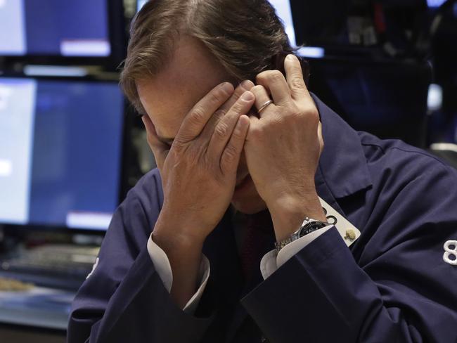 Trader Dudley Devine works on the floor of the New York Stock Exchange Thursday, May 21, 2015. U.S. stocks edged higher in early trading. Energy stocks rose more than the rest of the market as the price of oil climbed. (AP Photo/Richard Drew)