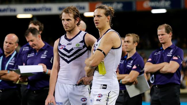 David Mundy and Nat Fyfe of the Dockers look on during the Ross Glendinning medal presentation in 2017.