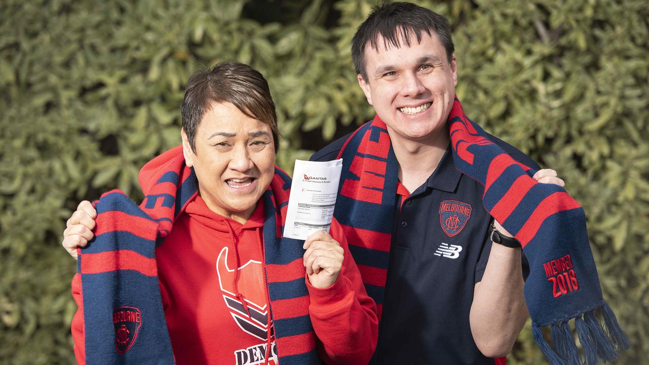 Devoted Demons supporter Andrew Pettman and his mum Shirley are flying to Singapore just so they can get to the AFL preliminary final in Perth. Picture: Ellen Smith