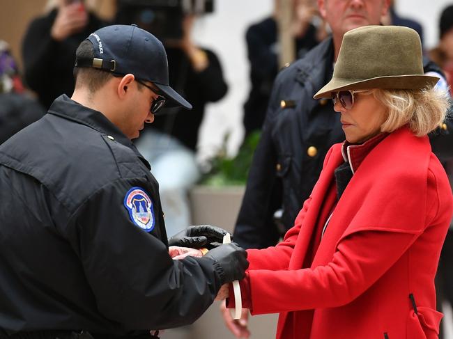 The moment Jane Fonda was arrested at a climate change protest. She says urgent action is needed to address the environmental crisis. Picture: AFP