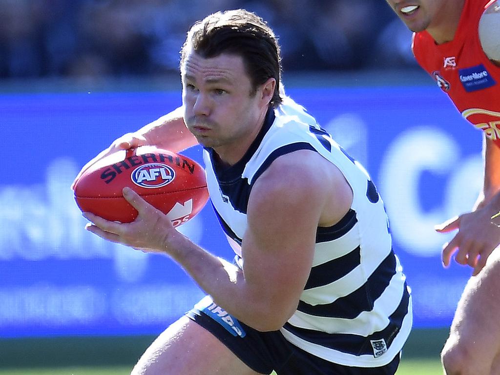 Patrick Dangerfield of the Cats (left) and Jarryd Lyons of the Suns are seen in action during the Round 23 AFL match between the Geelong Cats and the Gold Coast Suns at GMHBA Stadium in Geelong, Saturday, August 25, 2018. (AAP Image/Julian Smith) NO ARCHIVING, EDITORIAL USE ONLY