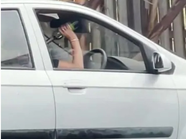 A Gold Coast woman was captured in February drinking from a wine bottle while behind the wheel. Picture: Sam Mangan/Instagram Source: Supplied