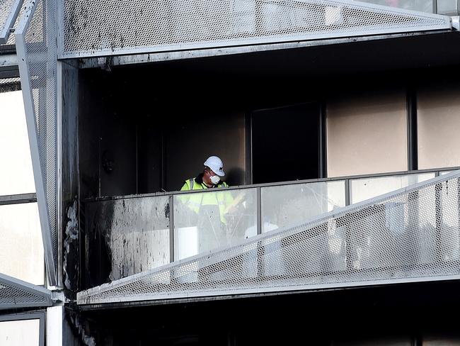 A fire investigator examines the scene at the 2014 Docklands fire. Picture: Nicole Garmston