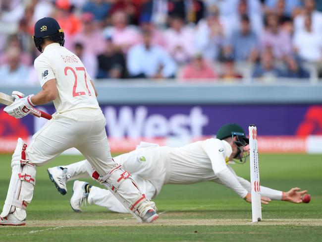 LONDON, ENGLAND - AUGUST 15: England batsman Rory Burns looks on as Cameron Bancroft dives to catch him out during day two of the 2nd Test Match between England and Australia at Lord's Cricket Ground on August 15, 2019 in London, England. (Photo by Stu Forster/Getty Images)