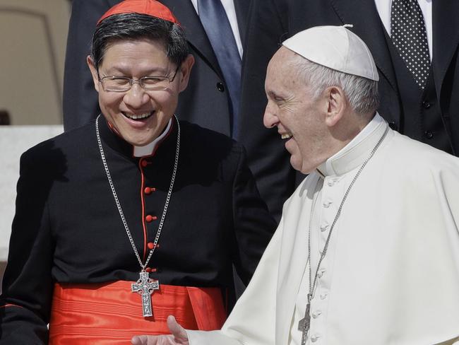 The late Pope Francis with Cardinal Luis Antonio Tagle. Picture: AP Photo/Andrew Medichini