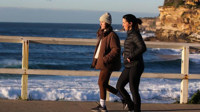 Locals are seen rugged up in winter weather gear at Bronte Beach in Sydney. Picture: Newsire / Gaye Gerard