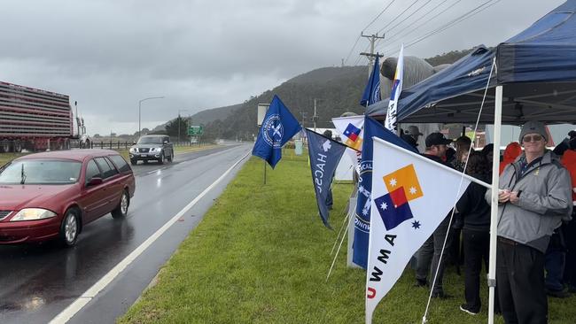 Maintenance workers from the Saputo Dairy factory in Burnie rallying on the side of the Bass Highway. Picture: Simon McGuire.