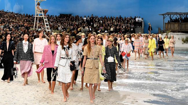 Lagerfeld with models wearing Chanel’s spring-summer collection in Paris last October. Picture: AFP