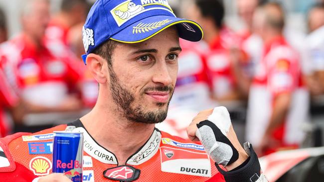 Second placed Ducati Team's Italian rider Andrea Dovizioso celebrates after the qualifying session of the MotoGP Austrian Grand Prix weekend at Red Bull Ring in Spielberg, Austria on August 12, 2017. / AFP PHOTO / Jure Makovec